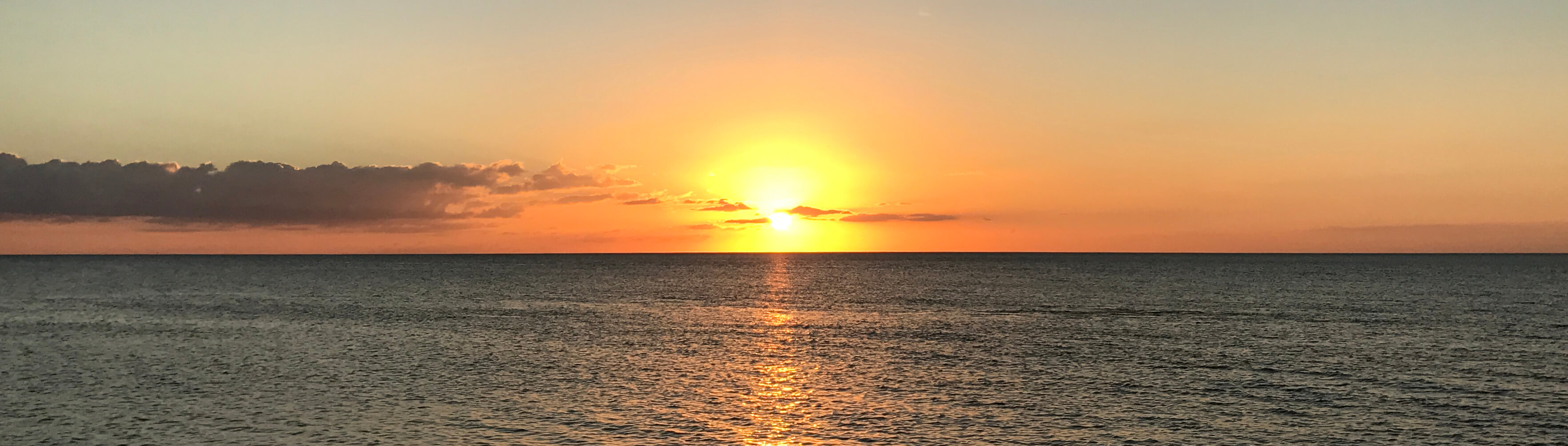 photo of a beautiful sunset over water